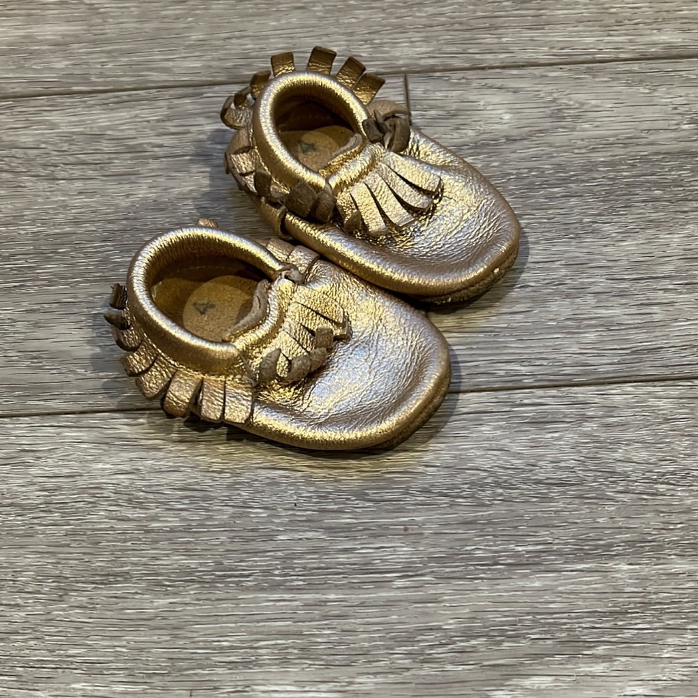 Gold fringe baby moccasins